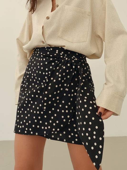 MINIGONNA A POIS CON CHIUSURA A PORTAFOGLIO - NERO 58925